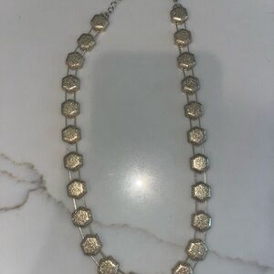 Stylish gold-toned necklace hexagonal-shaped links connected by delicate links
